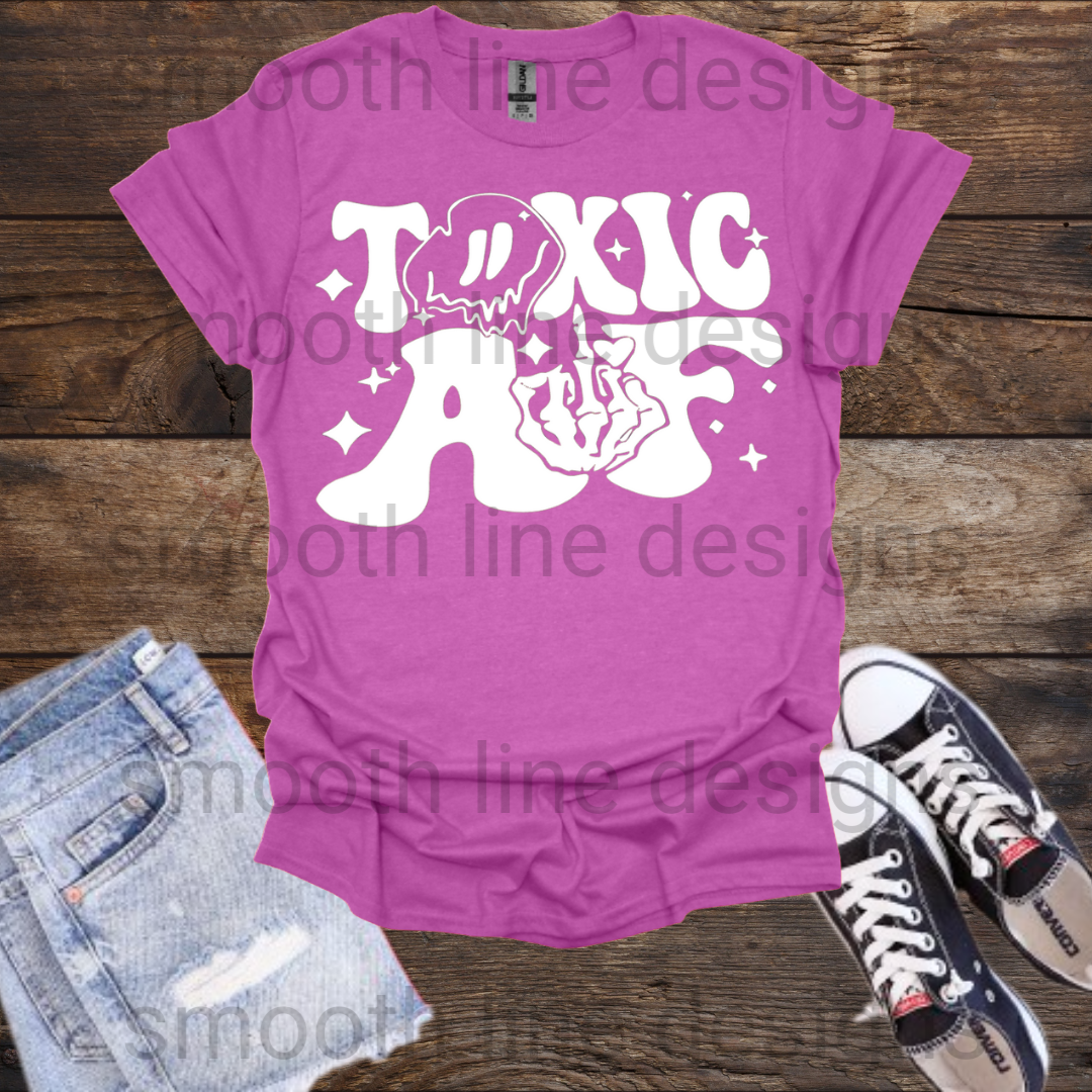 Embrace your sassy side with this Toxic AF Shirt! Featuring a bold skeleton giving the middle finger, this shirt is perfect for anyone with a fierce attitude and a sense of humor. Whether you're a toxic girlfriend or just love funny meme shirts, this tee is sure to get attention.  