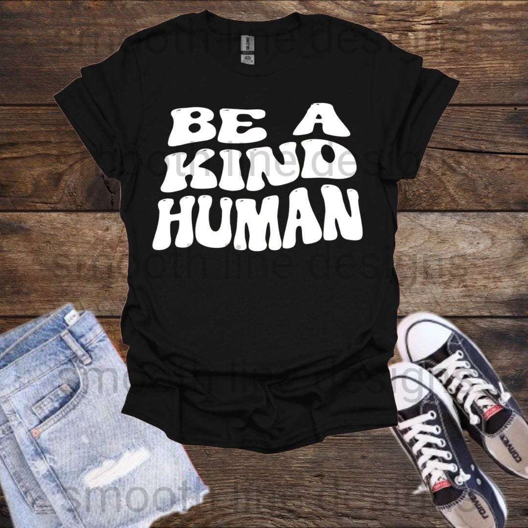 Spread positivity with this "Be a Kind Human" t-shirt! Made from soft, comfortable fabric, this shirt features an inspiring message that’s perfect for everyday wear.